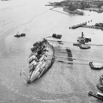 USS Oklahoma being righted